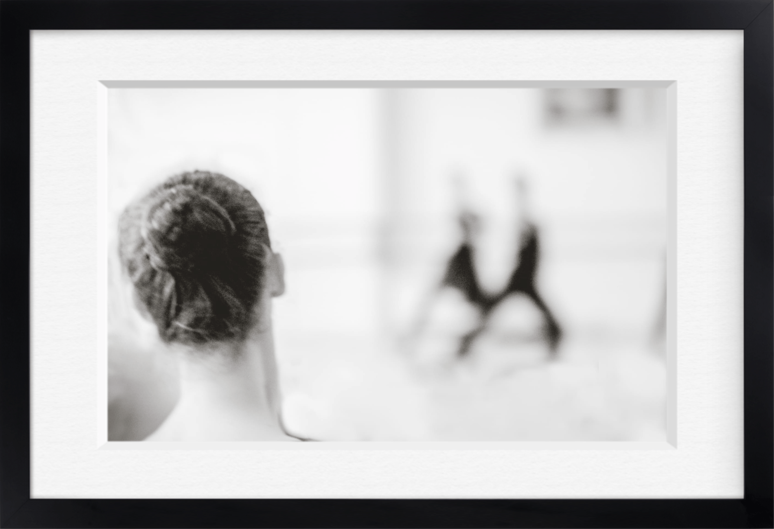 Soft-focus black and white framed archival print of a ballerina seen from behind
