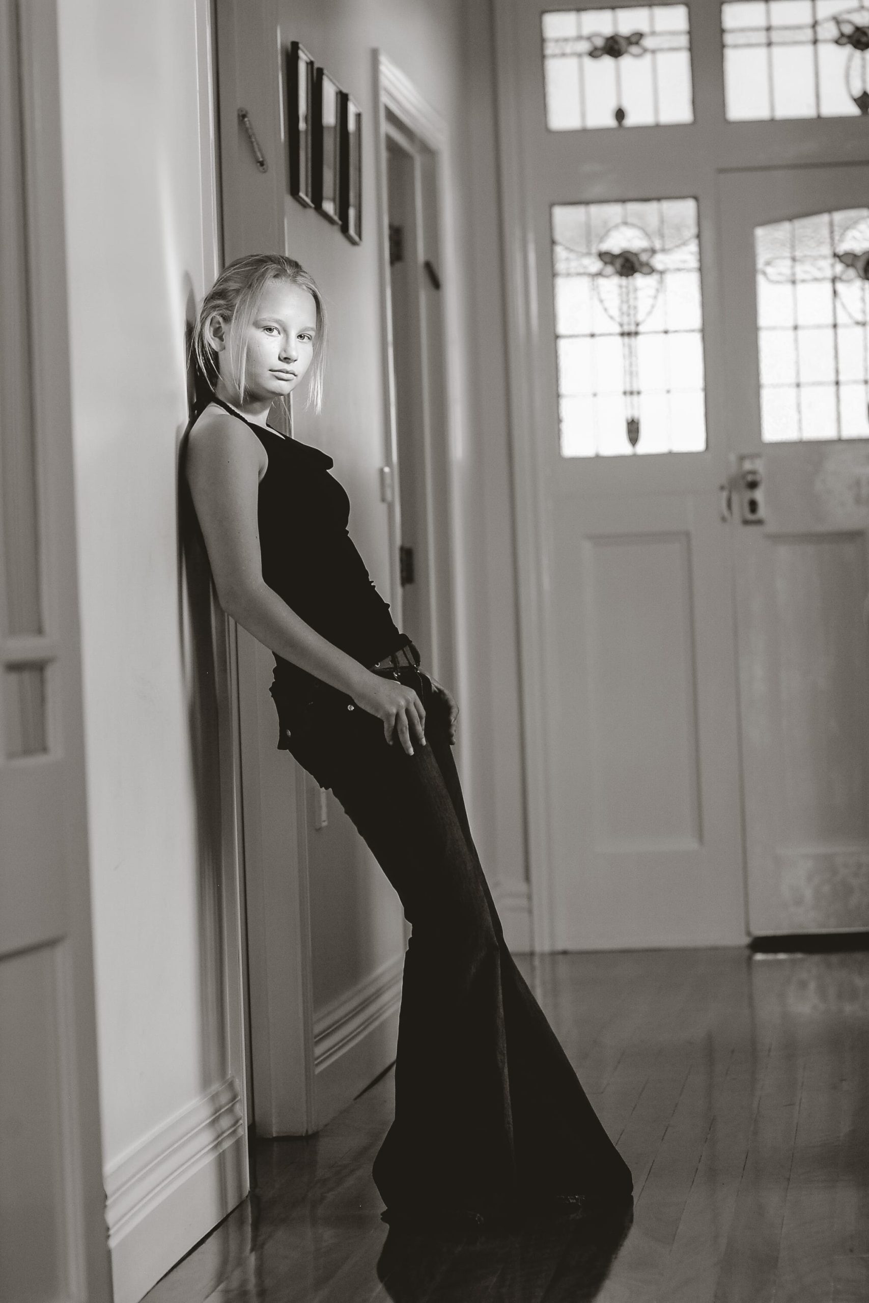 Confident twelve-year-old girl in her home during Bat Mitzvah year – natural-light generational portrait by Arnold Szmerling