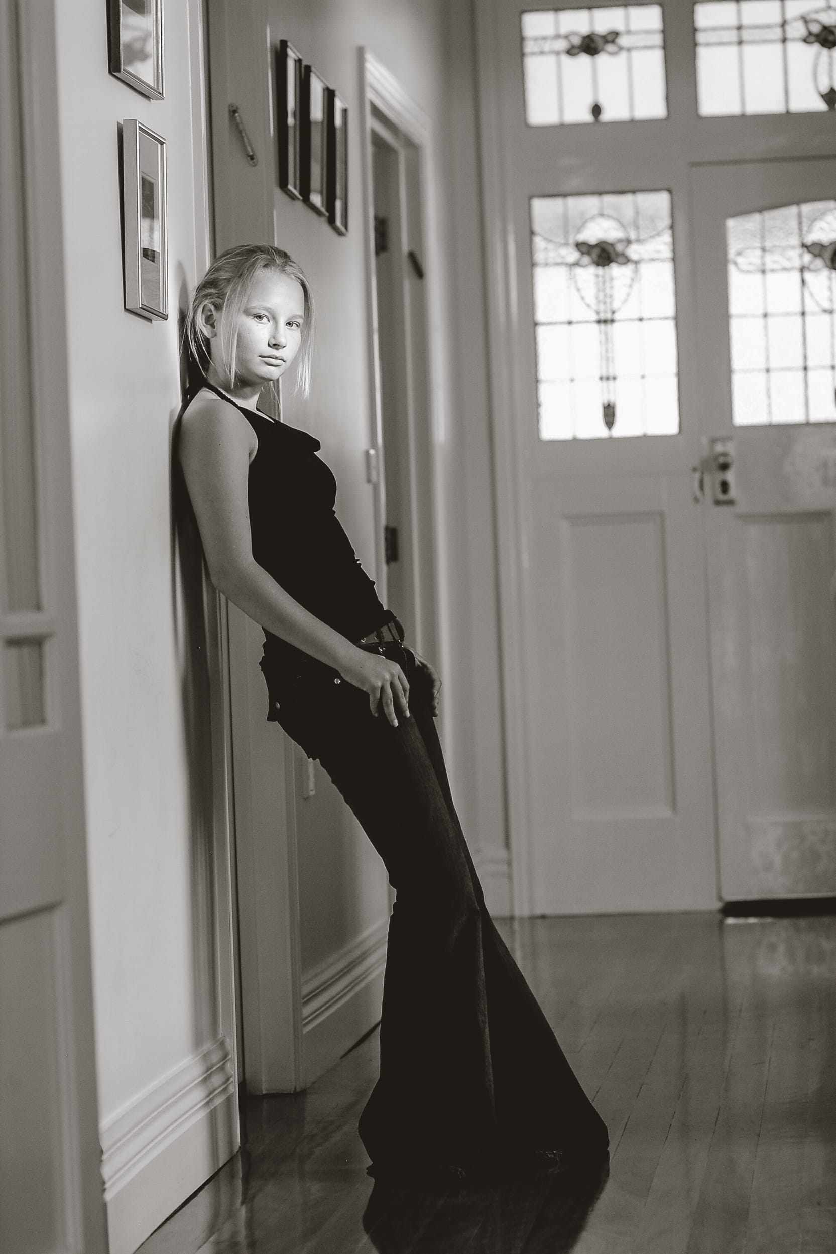 Confident twelve-year-old girl in her home during Bat Mitzvah year – natural-light generational portrait by Arnold Szmerling