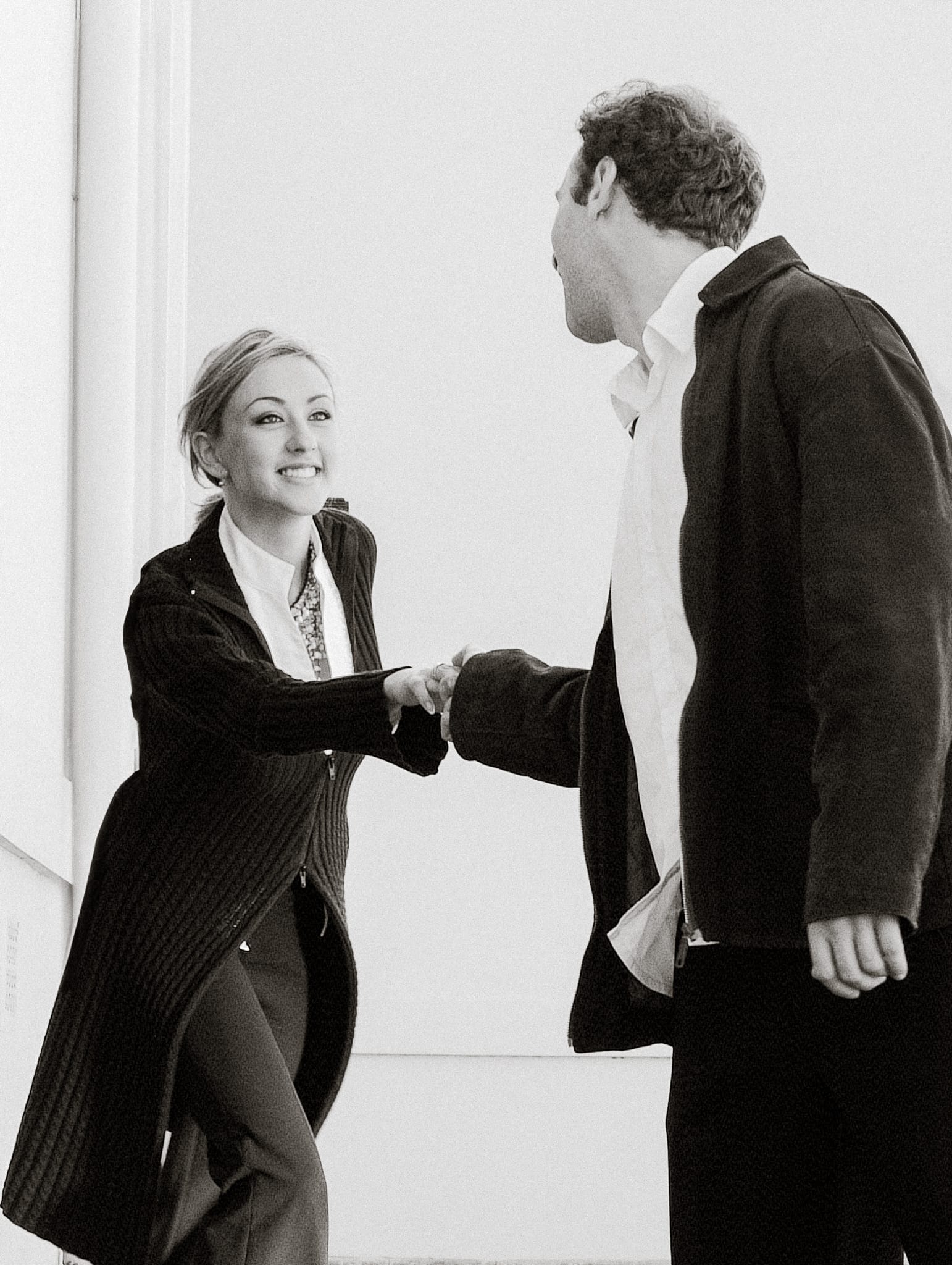 Black-and-white embrace of a couple on the verge of a kiss – intimate Melbourne moment by Arnold Szmerling