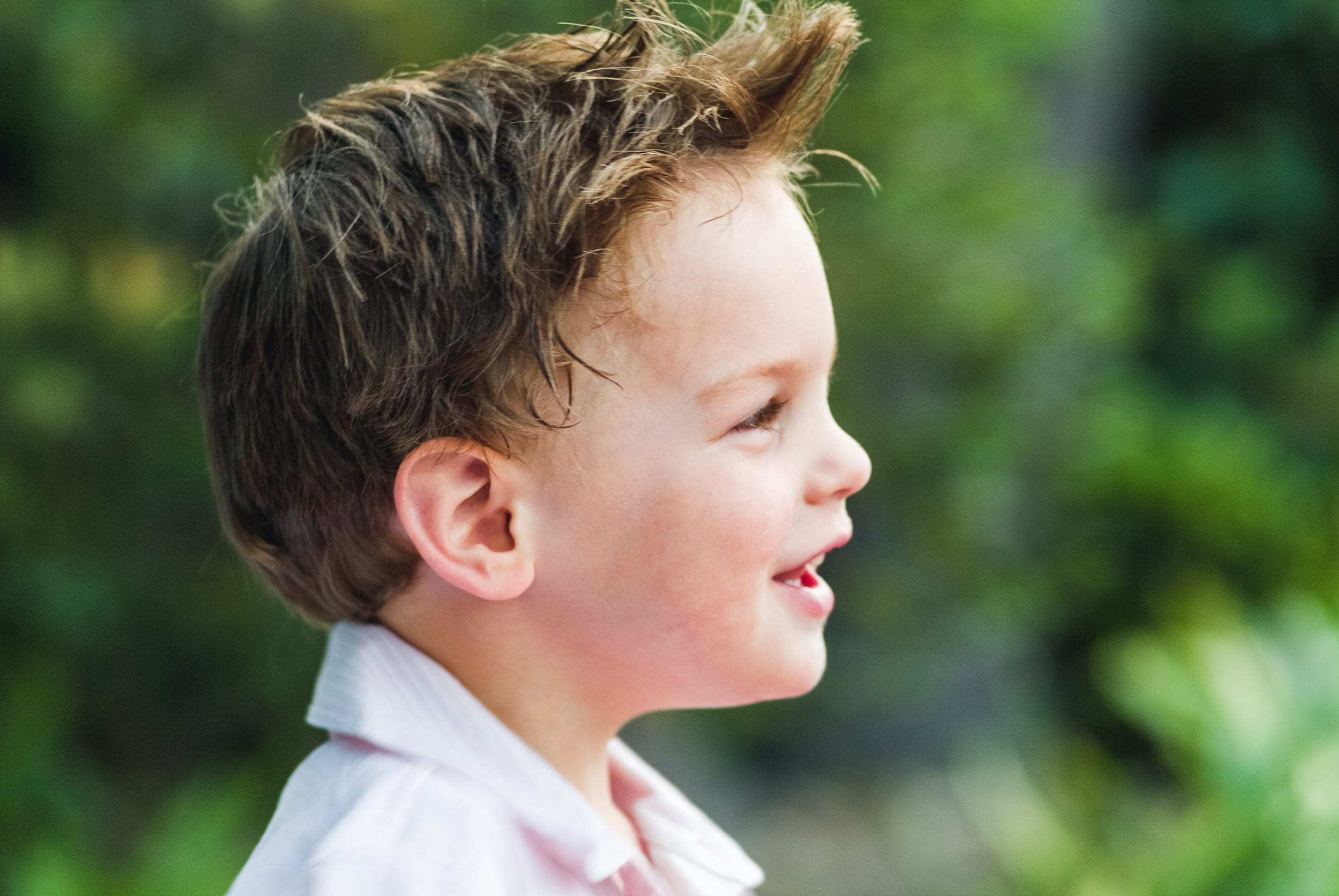 A colour profile angle of young boy, Melbourne, Australia, captured with natural light for the 2026 Founder’s Residency by Arnold Szmerling.