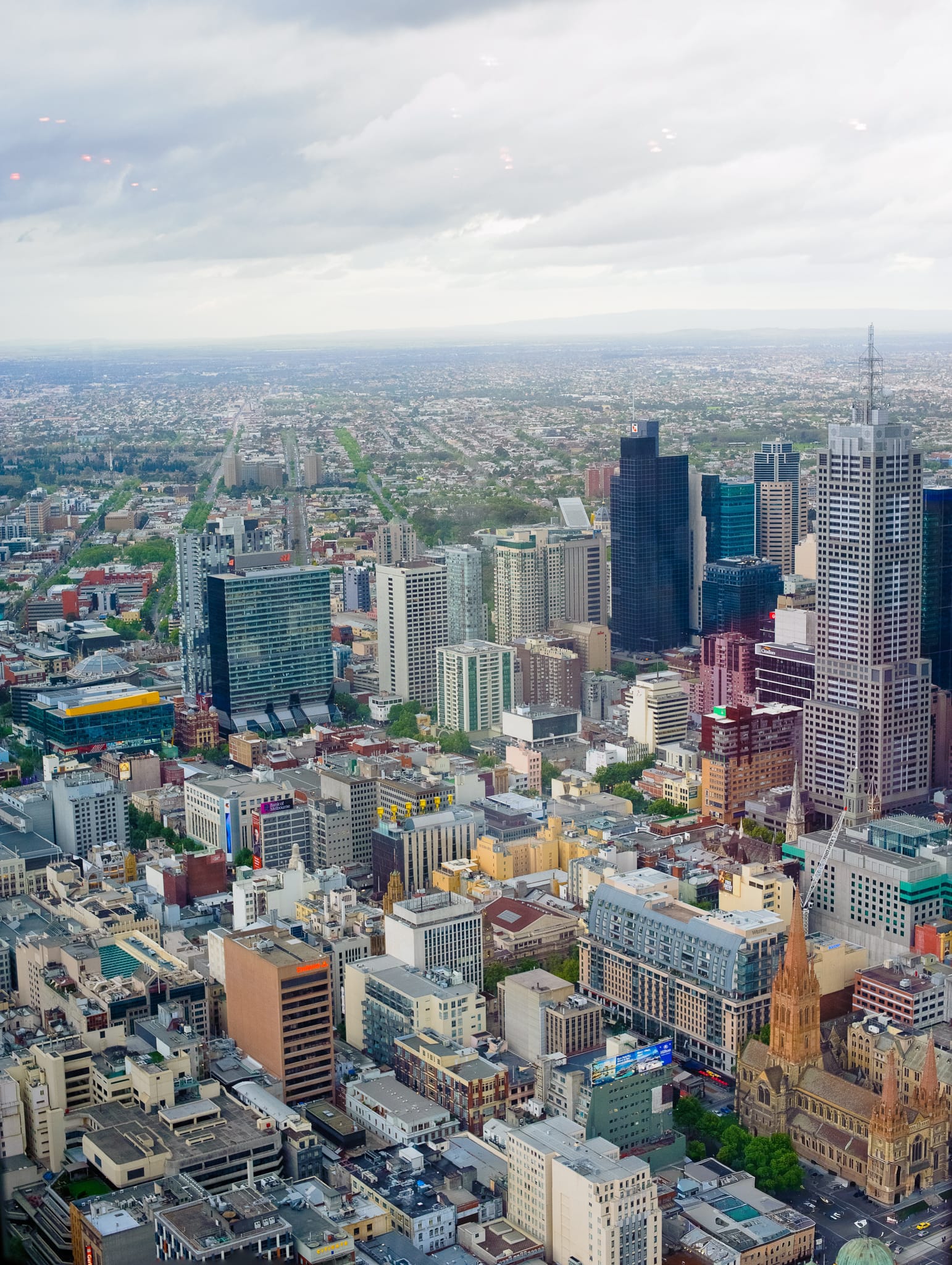 Panoramic Melbourne city skyline from above – atmospheric legacy context captured by Arnold Szmerling